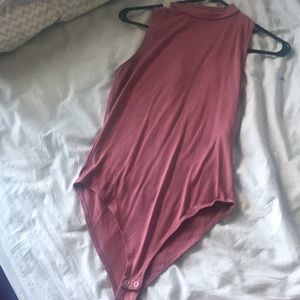 Pink turtleneck bodysuit